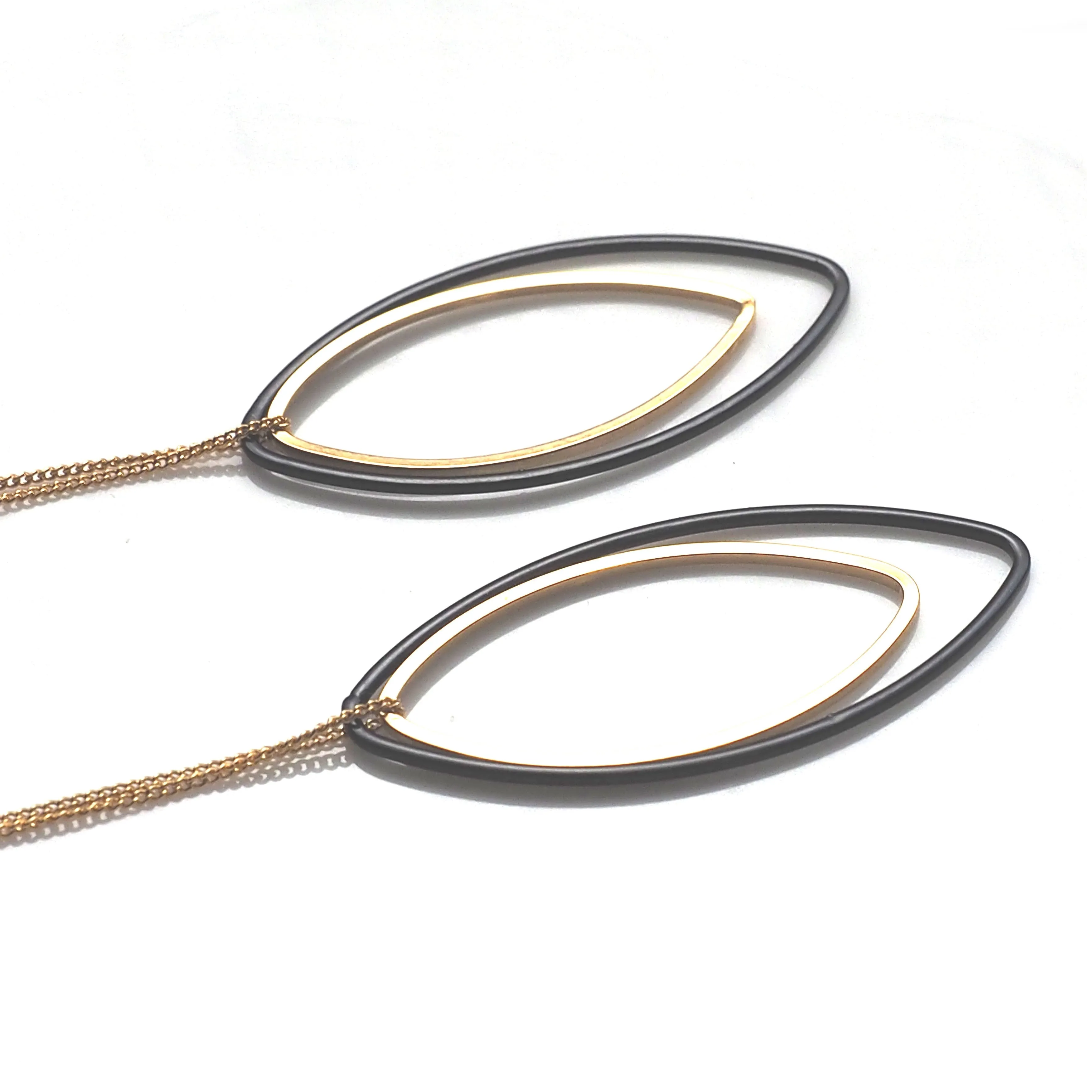 Long gold and black oval hoop invisible clip on earrings