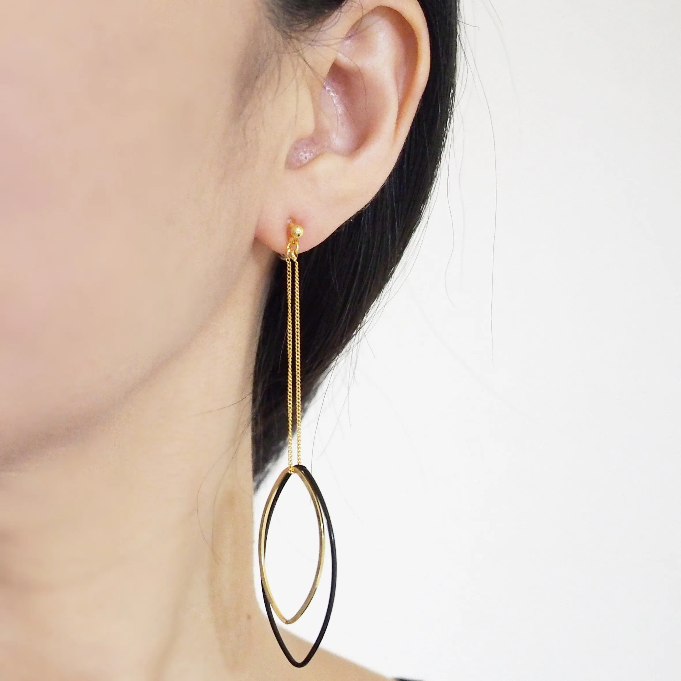 Long gold and black oval hoop invisible clip on earrings